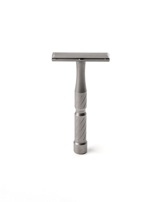 Vector Titanium razor by Blackland Razors with a sleek titanium handle and a closed comb safety razor head.