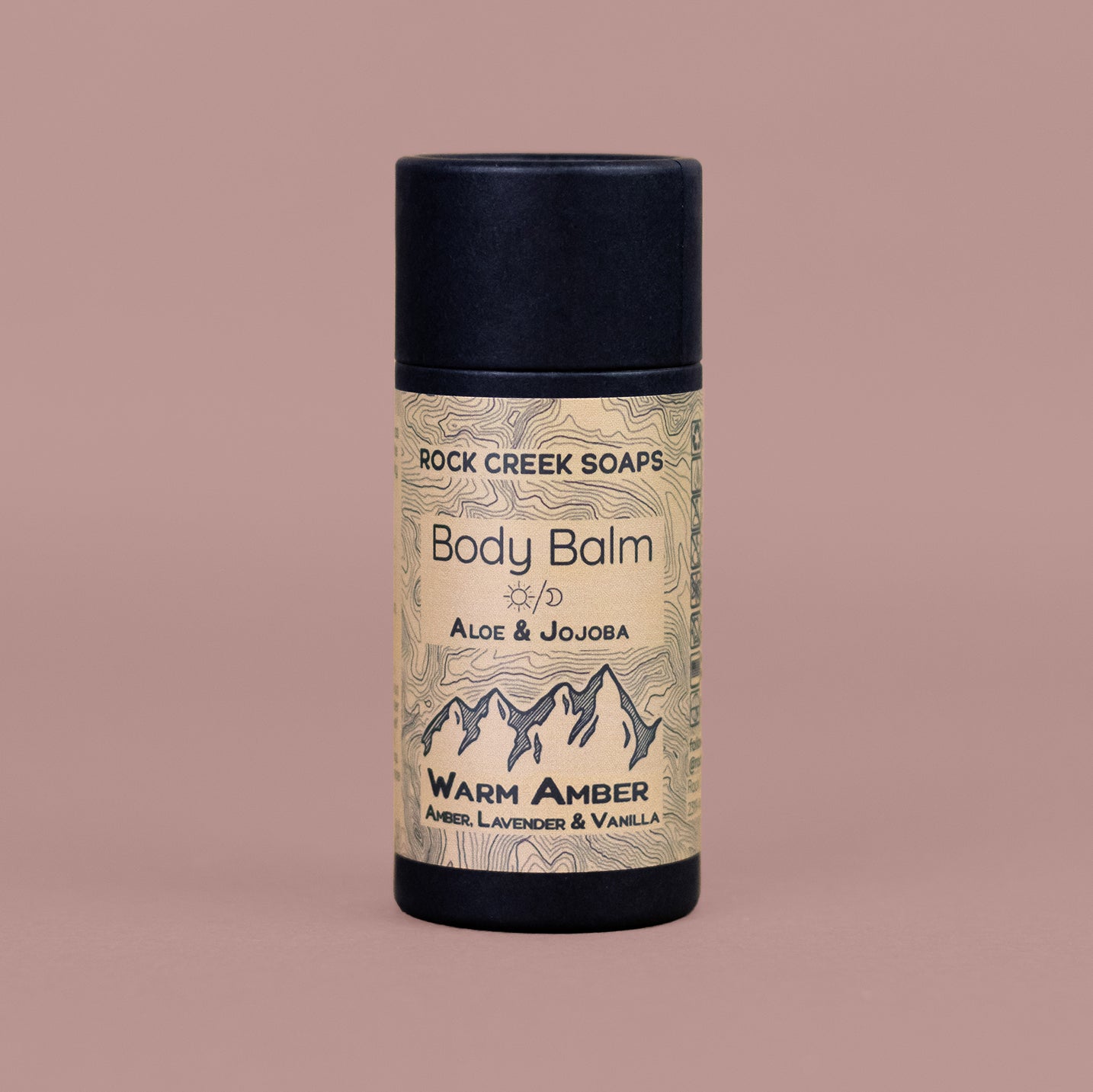 Solid body balm bar by Rock Creek Soaps featuring warm amber, vanilla, and French lavender scent in a natural, smooth lotion form.