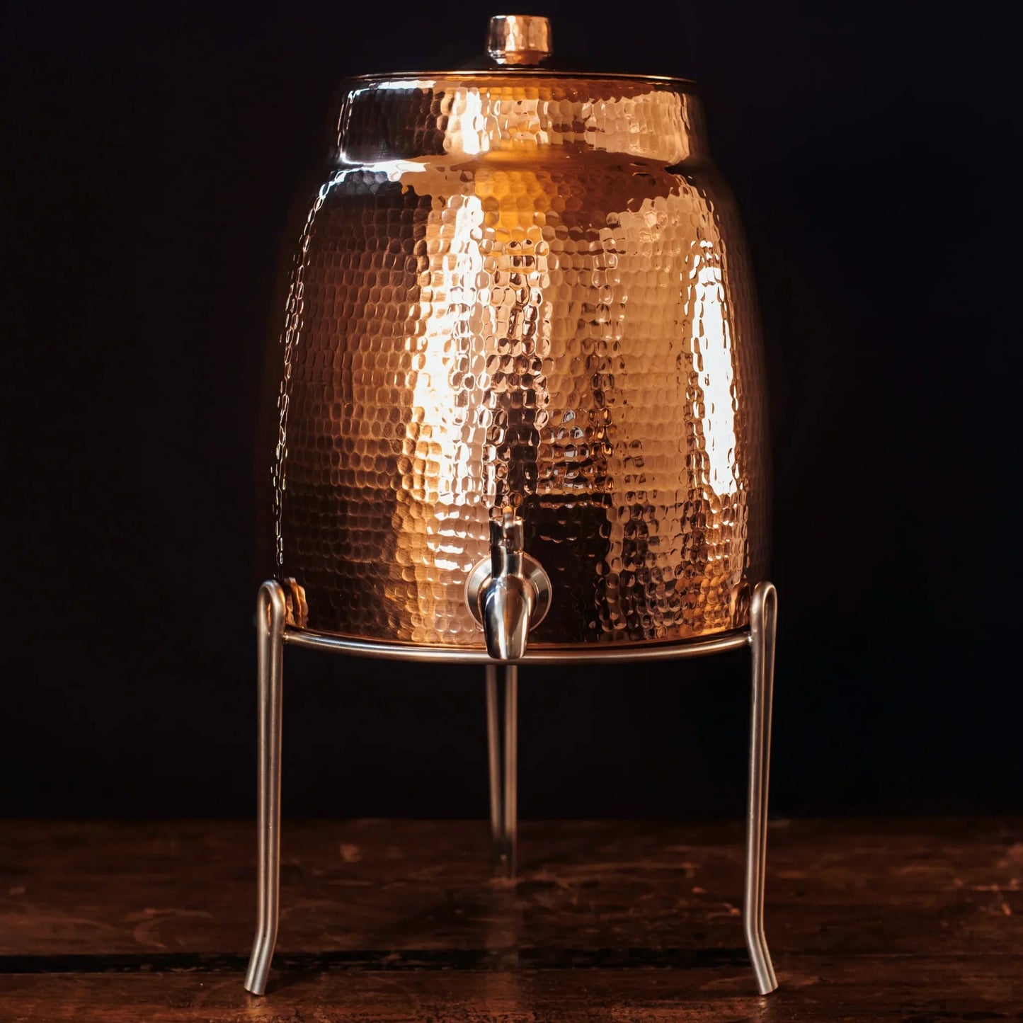 Stainless steel water dispenser stand by Sertodo, designed to hold water dispensers securely with a sleek, durable metal frame.