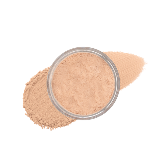 Warm light loose mineral foundation by Taylor Made Organics in a jar with a smear of the powder visible.