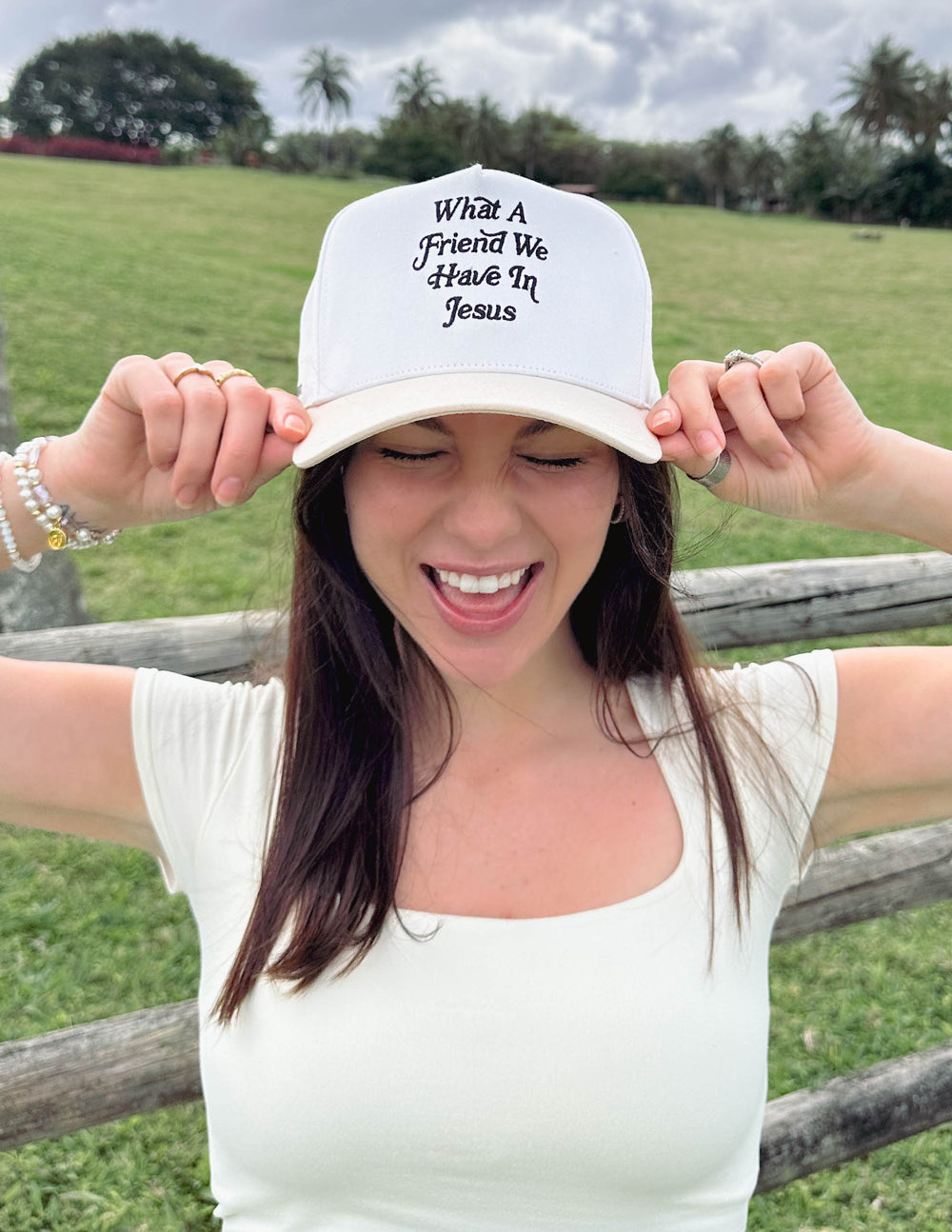 Elevated Faith trucker hat featuring the "What a Friend in Jesus" design, with mesh back and adjustable strap for a casual look.