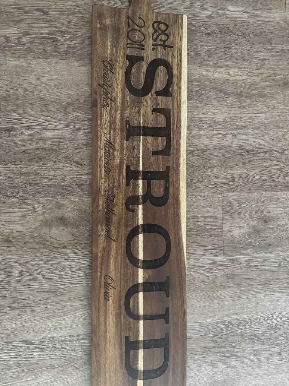 Custom engraved wooden charcuterie board with personalized design, serving tray from C2 Creations LLC, featuring a polished finish.