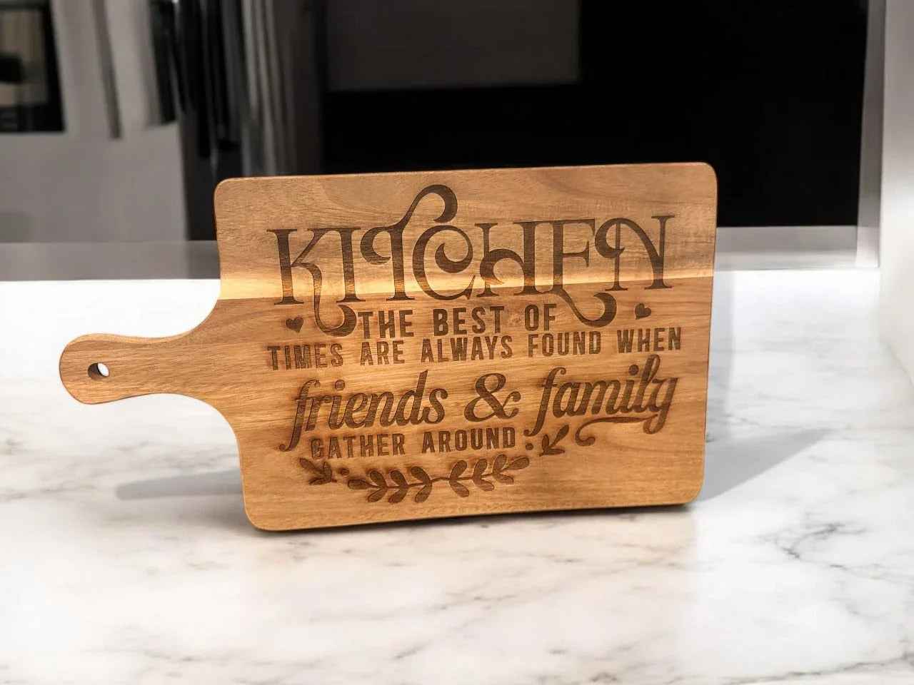 Personalized wooden cutting board from C2 Creations LLC, custom serving and chopping board with engraved design, wood grain visible.