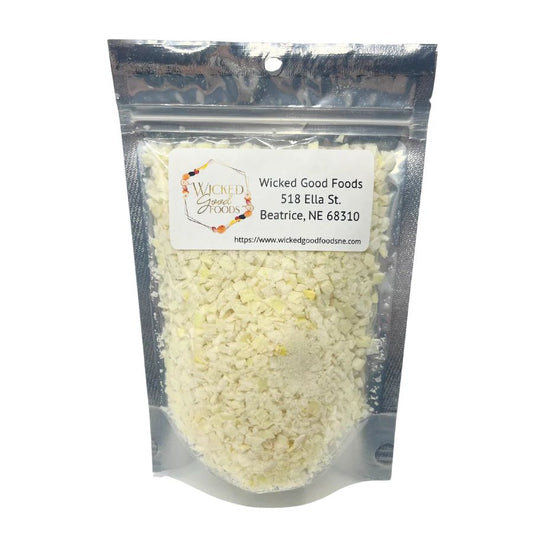 Freeze dried yellow onions from Wicked Good Foods in a 1 oz package, perfect for cooking and seasoning.
