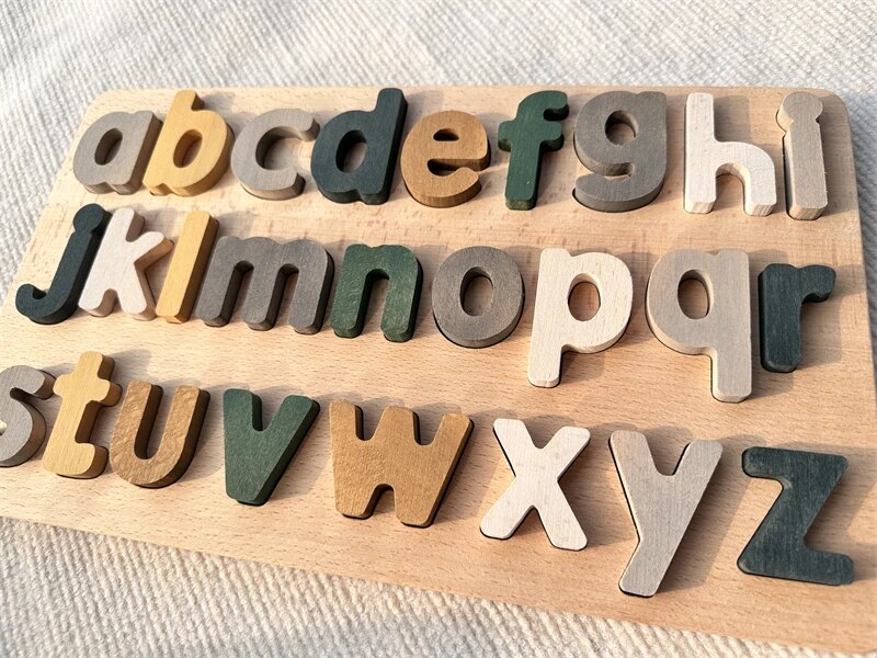 Colorful Montessori wooden puzzles featuring alphabet pieces by Petite Pioneers, perfect for early childhood learning and development.