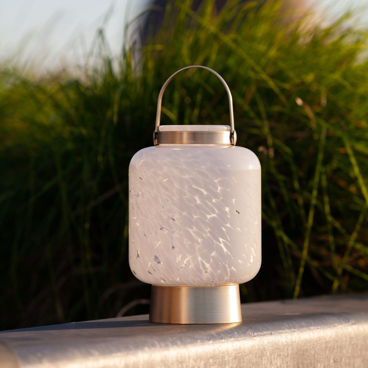 Allsop Home & Garden LightKeeper rechargeable glass LED lanterns with glowing illumination and sleek cone design.