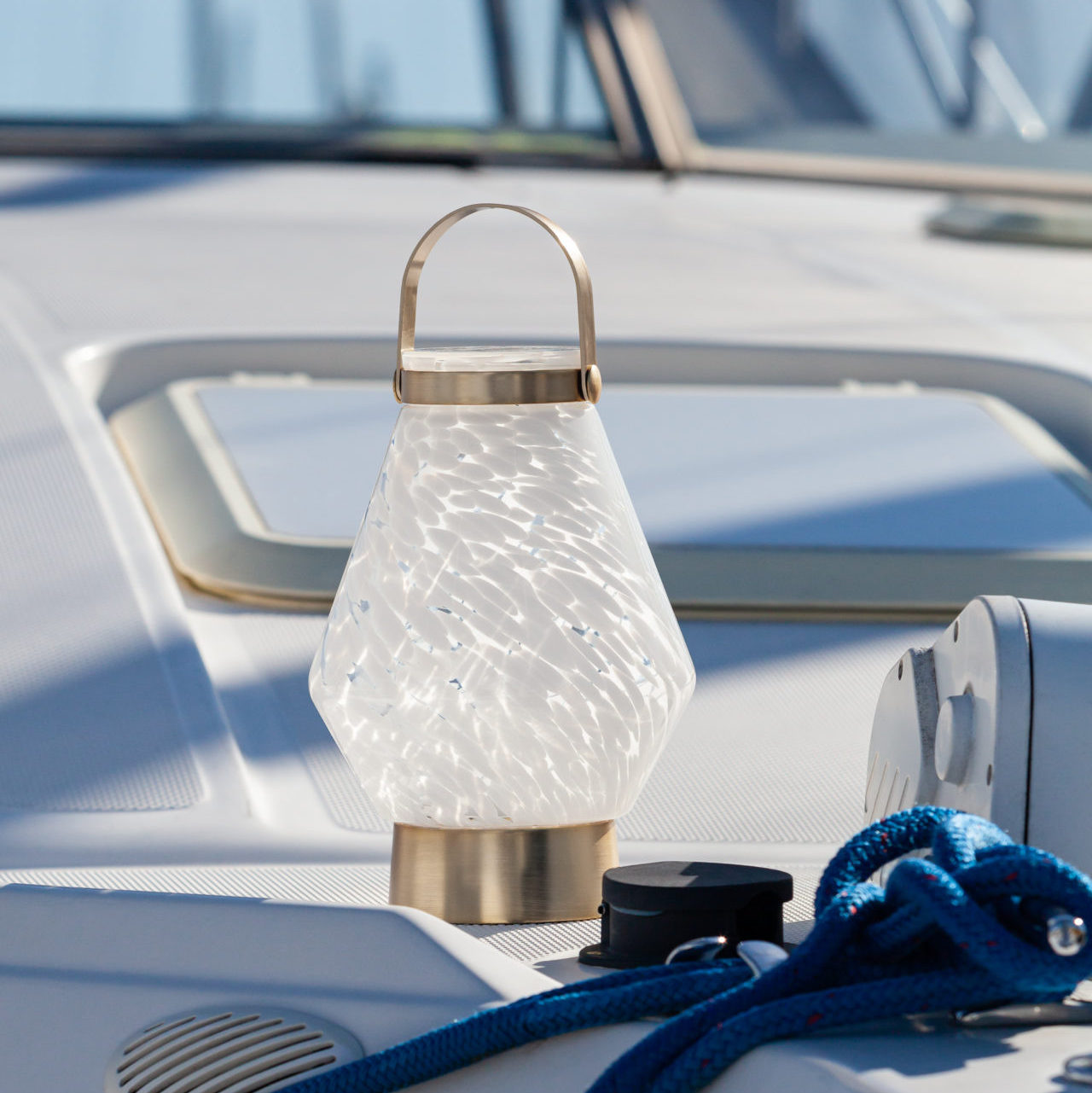 Allsop Home & Garden LightKeeper rechargeable glass LED lanterns with handles, showing a modern, clear glass design and ambient lighting