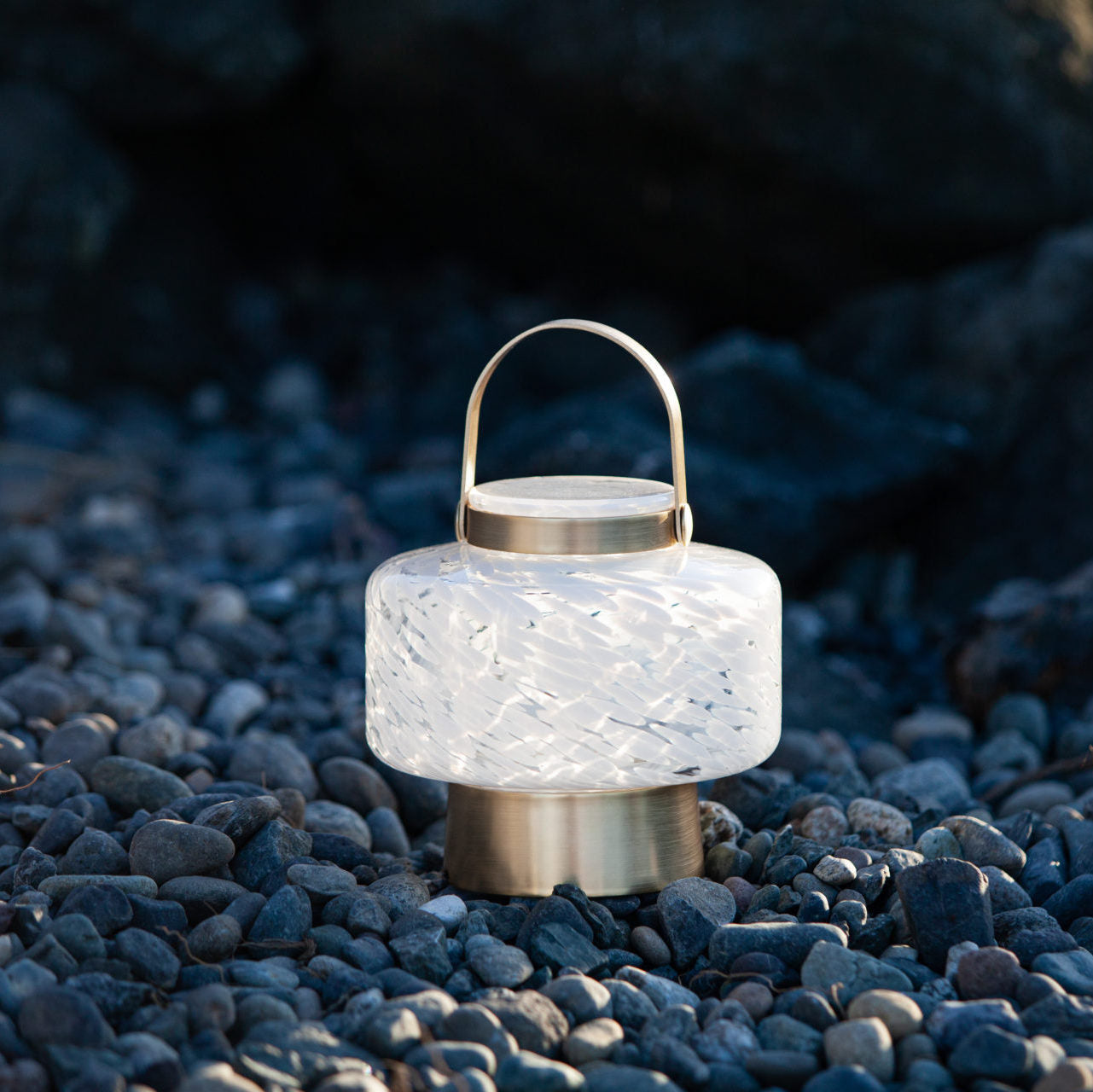 Allsop Home & Garden LightKeeper Rechargeable Glass LED Lanterns with handle and glowing interior, suitable for indoor and outdoor use.