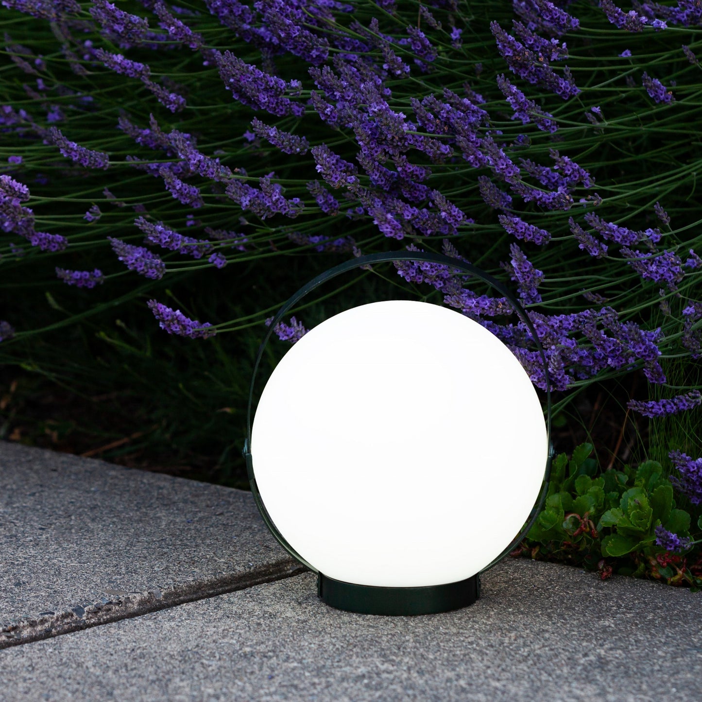 Allsop Home & Garden Moonrise portable rechargeable LED lantern with handle, emitting bright light, suitable for outdoor use
