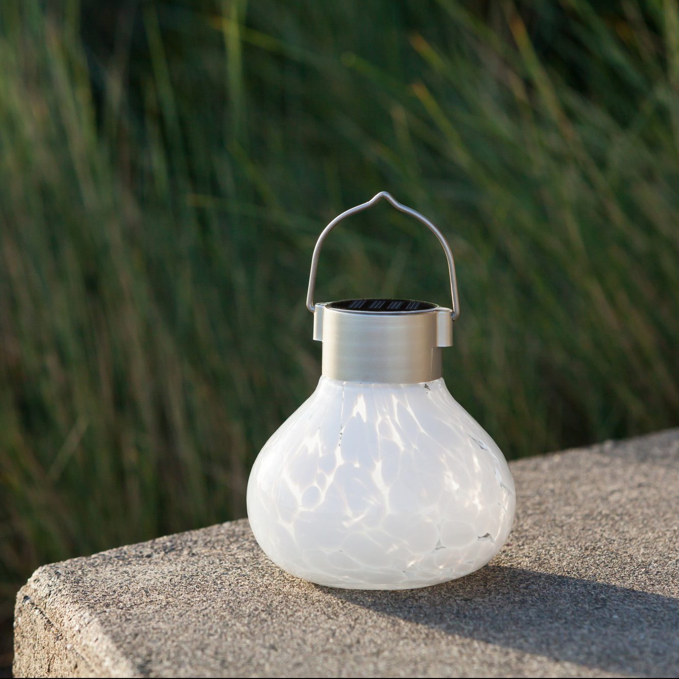 Periwinkle solar tea lantern by Allsop Home & Garden featuring handblown glass and a 5-inch size, ideal for outdoor decor.