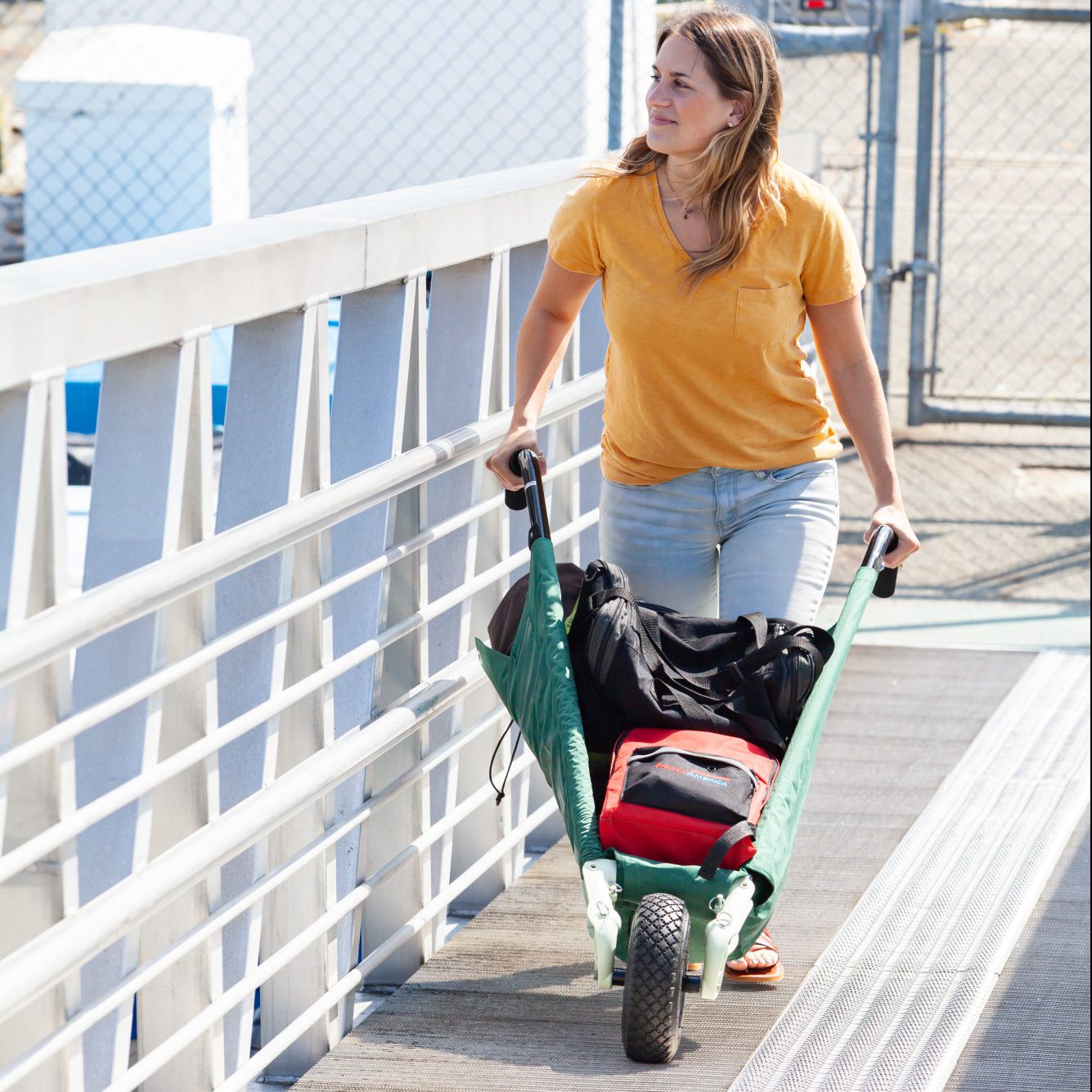 Allsop Home & Garden WheelEasy LE foldable garden cart, a durable wheelbarrow with a sturdy handle and large wheel for easy gardening tasks.