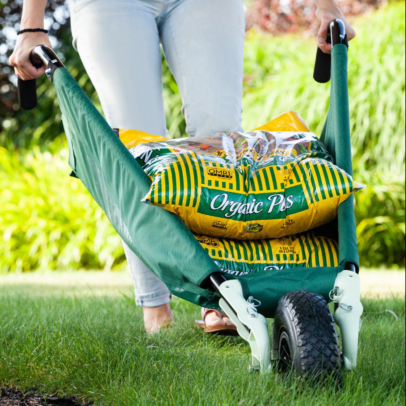 Allsop Home & Garden WheelEasy LE foldable garden cart wheelbarrow with sturdy handles and large wheel for easy gardening tasks.