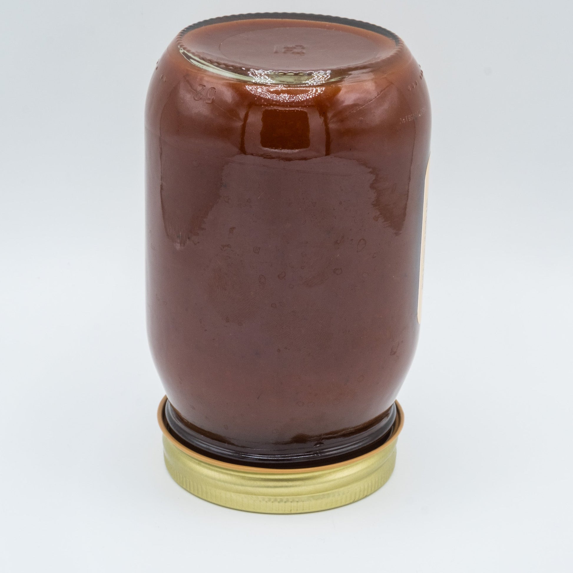 Canned Amish Country Store Apple Butter BBQ Sauce 16 oz jar with a rustic label and lid, ready for grilling or dipping.