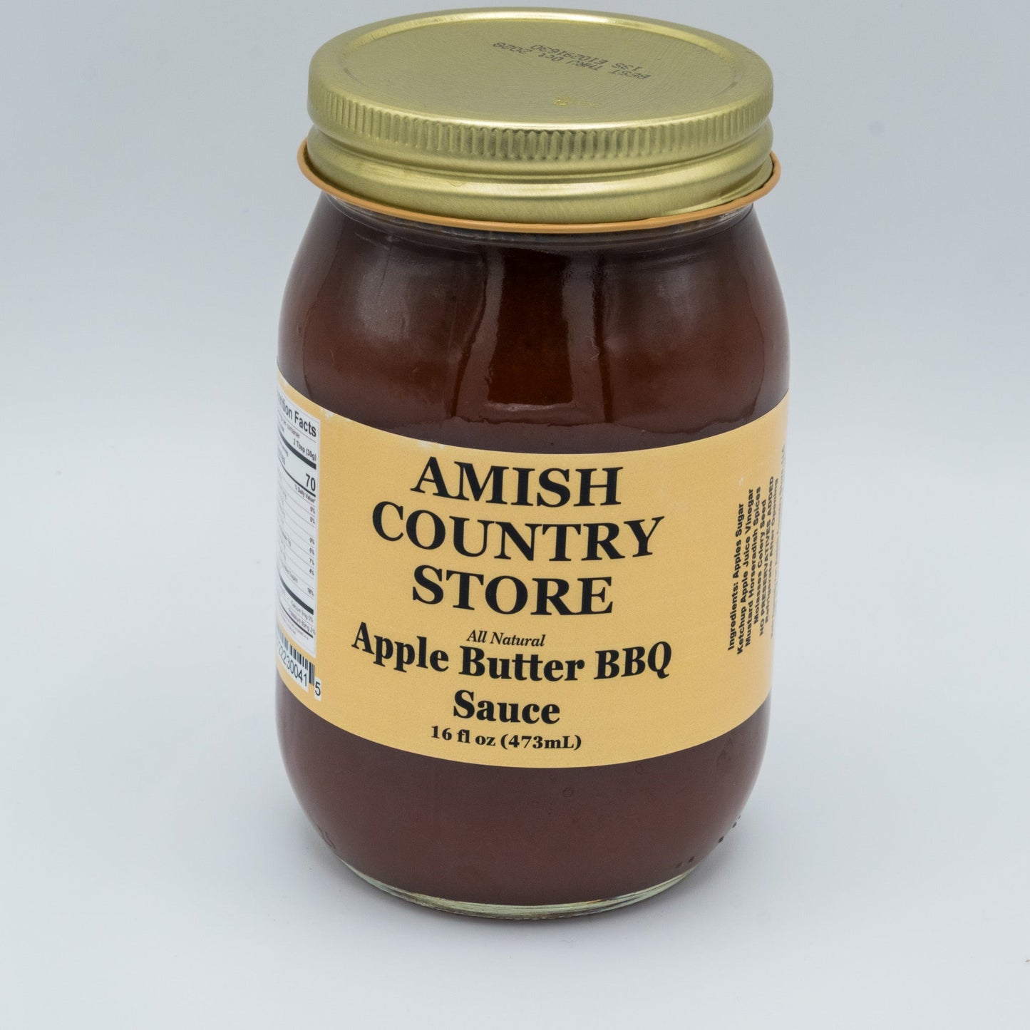 Canned Amish Country Store Apple Butter BBQ Sauce in 16 oz jar, showing the label and sauce inside the container