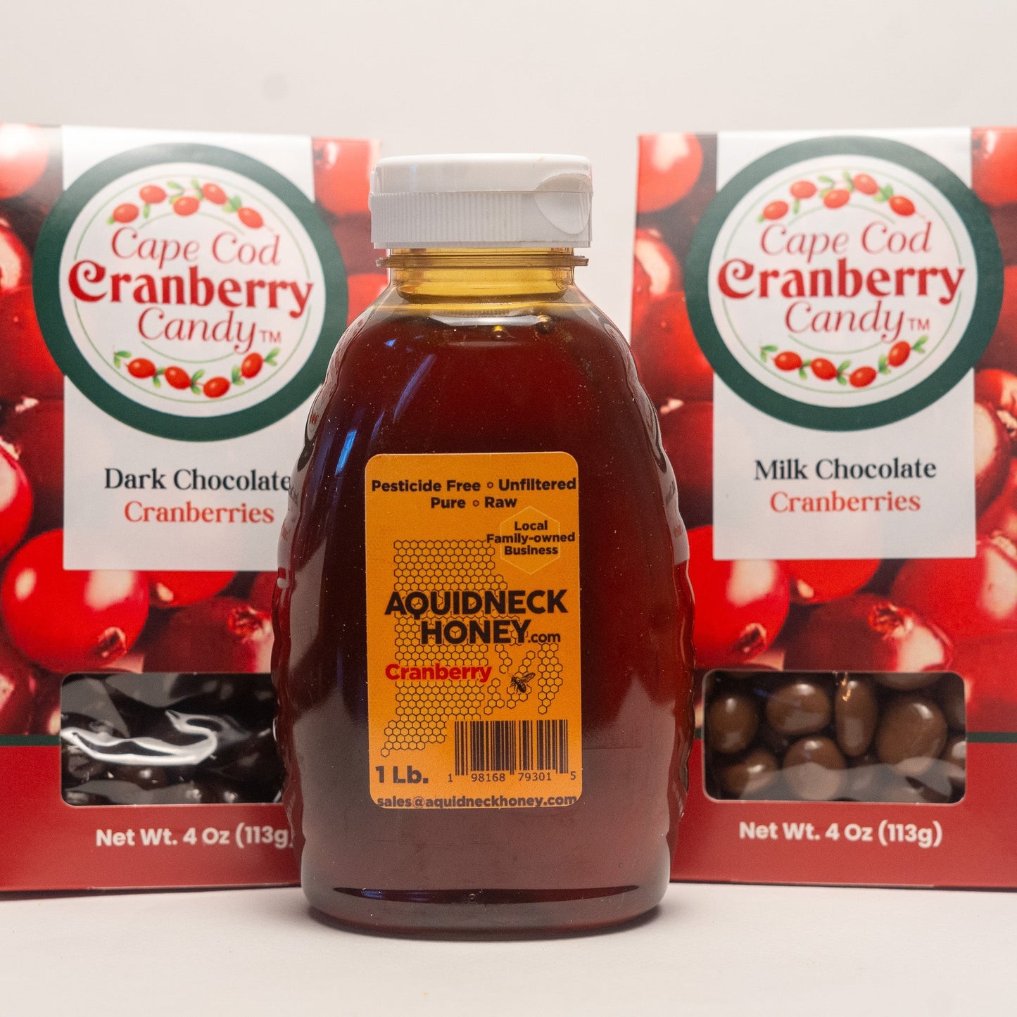 Aquidneck Honey Cranberry Honey and Chocolate Gift Box with jars of honey and chocolates in a decorative box.