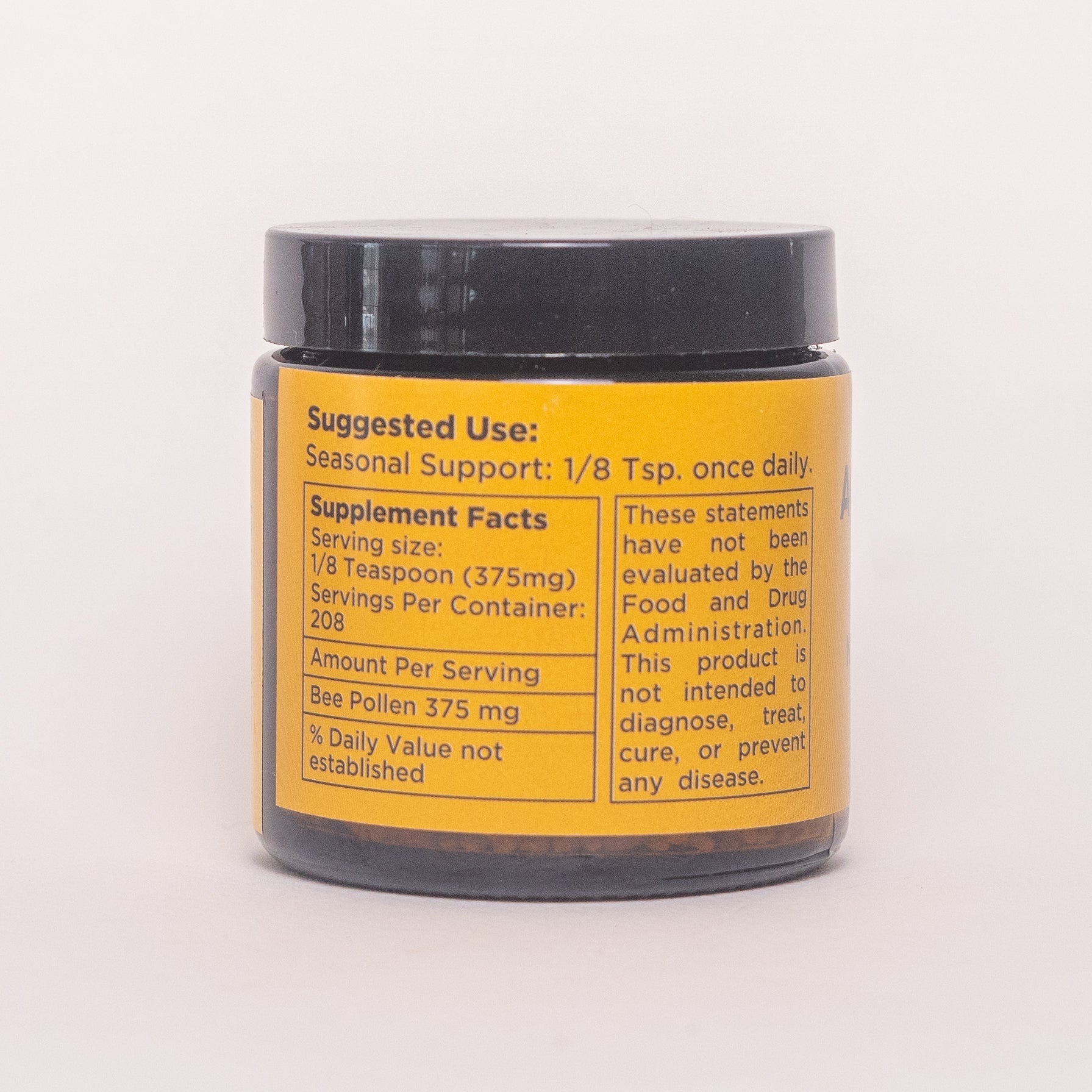 Pure raw bee pollen from Aquidneck Honey, showcasing golden granules collected from bees in New Hampshire, Rhode Island, and Massachusetts.