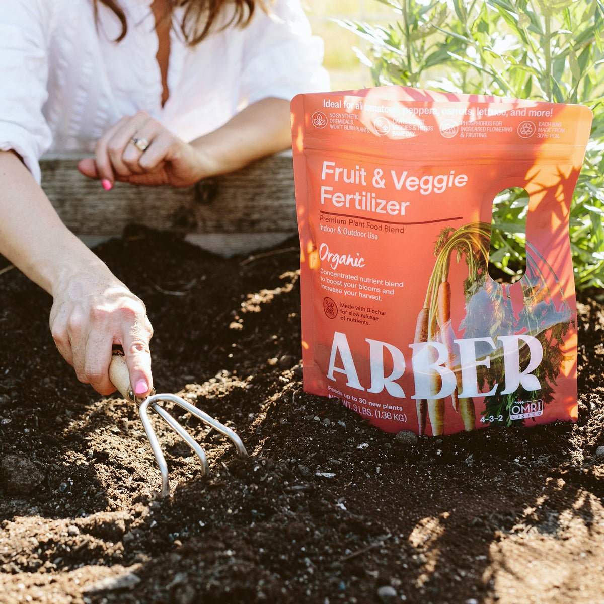 Organic Fruit and Veggie Fertilizer by Arber, showing a bag of natural plant fertilizer for healthy produce.