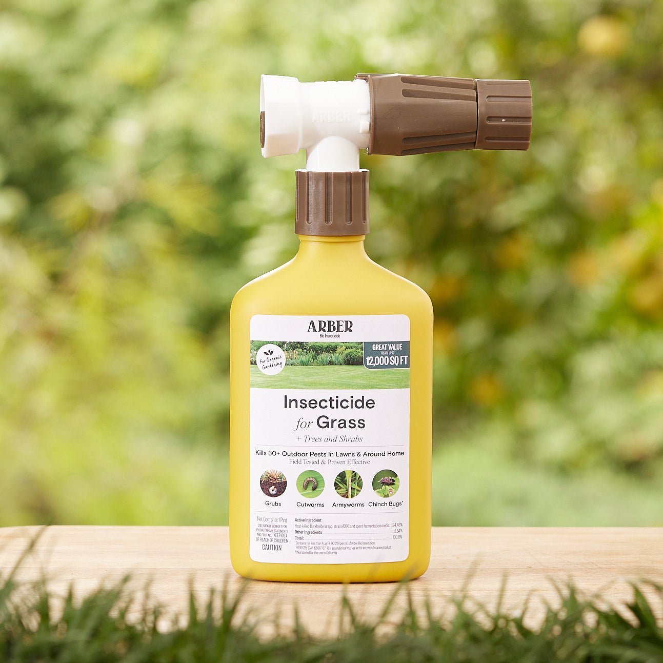 Organic insecticide for grass, trees, and shrubs by Arber, with a spray bottle showing the natural pest control solution.