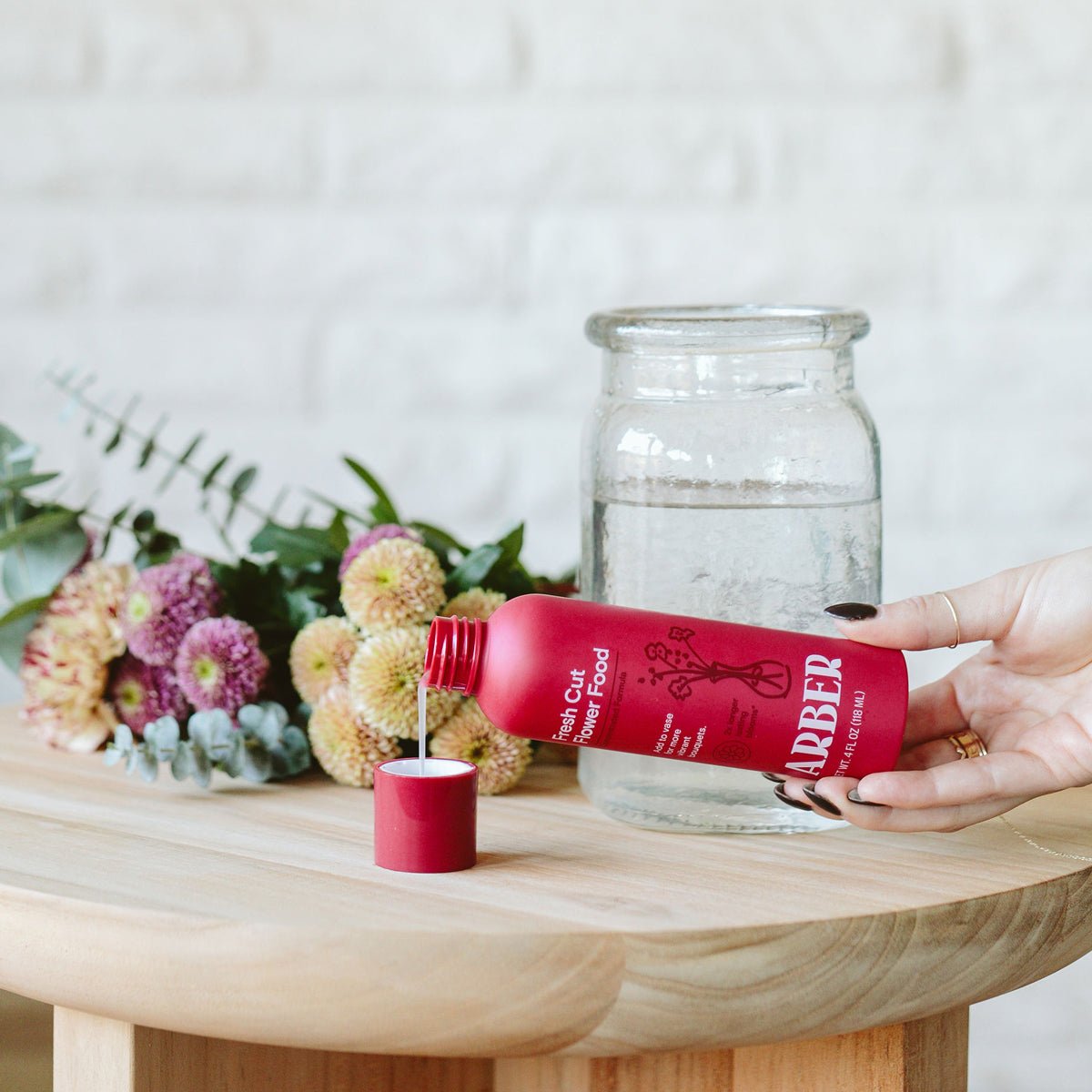 Bottle of Arber Fresh Cut Flower Food for maintaining fresh cut flowers and floral arrangements.