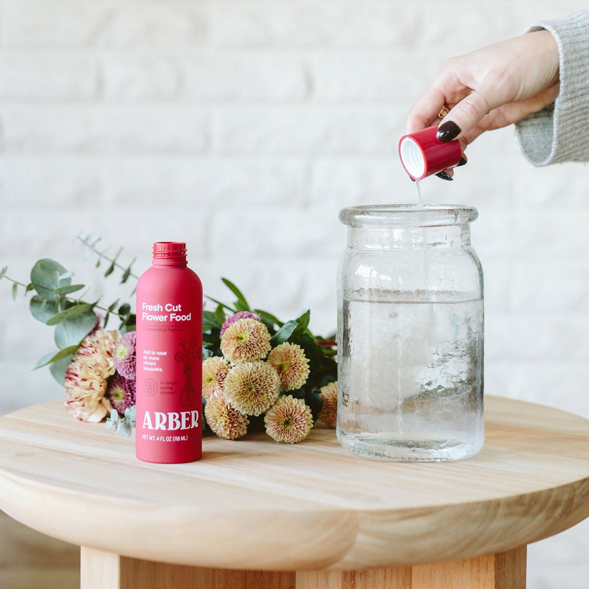 Bottle of Arber Fresh Cut Flower Food for maintaining fresh cut flowers and floral arrangements.