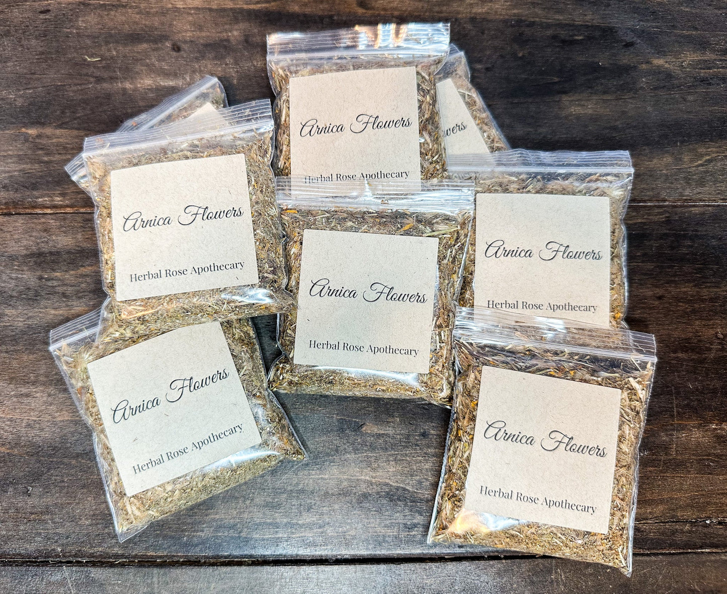 Dried arnica flowers from herbalroseapothecary, showcasing vibrant yellow blossoms for herbal remedies and natural healing.