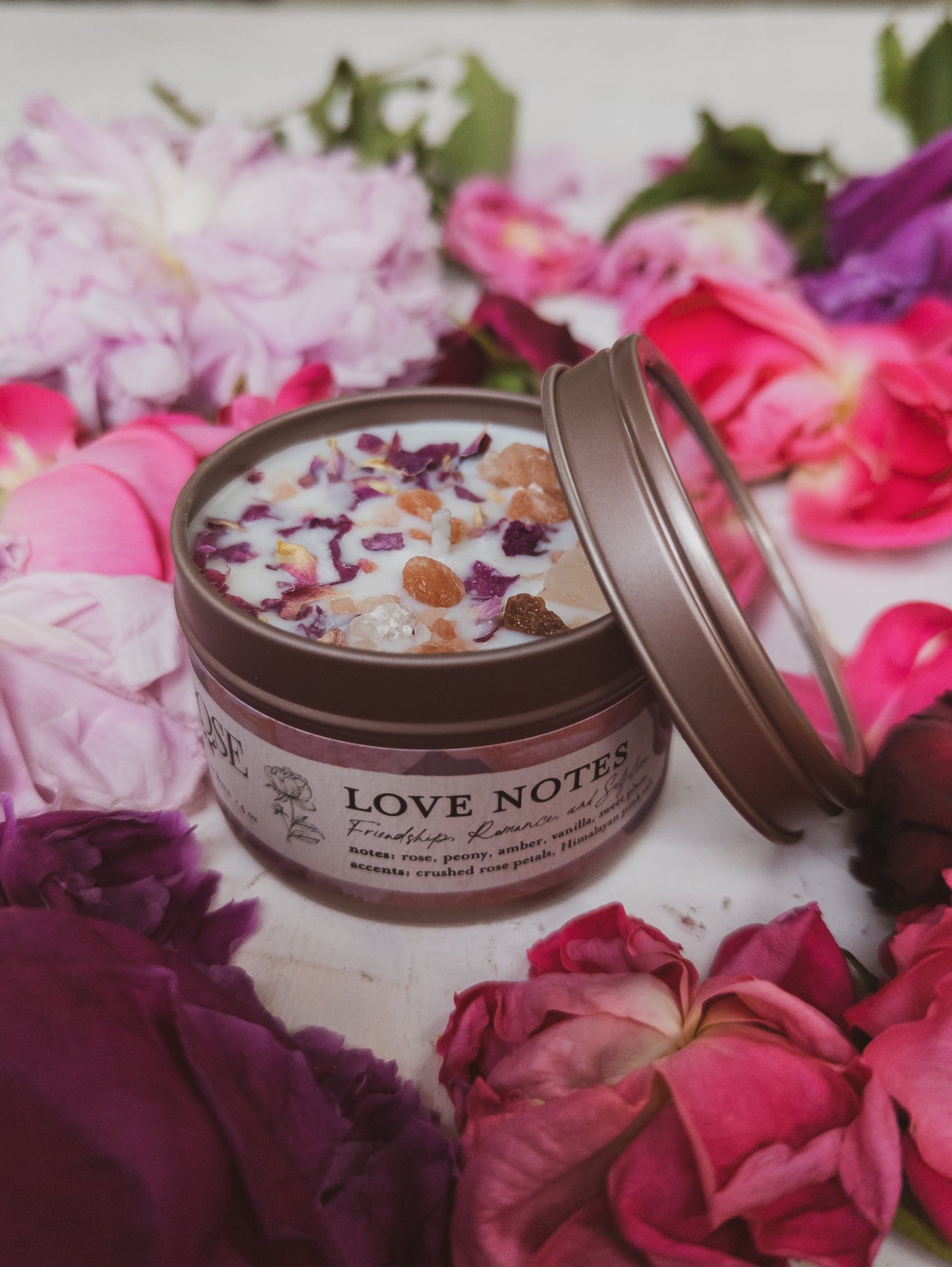 Ash & Rose LOVE NOTES Rose and Pink Salt Candle showing a 4 oz candle with a white container and pink rose design.