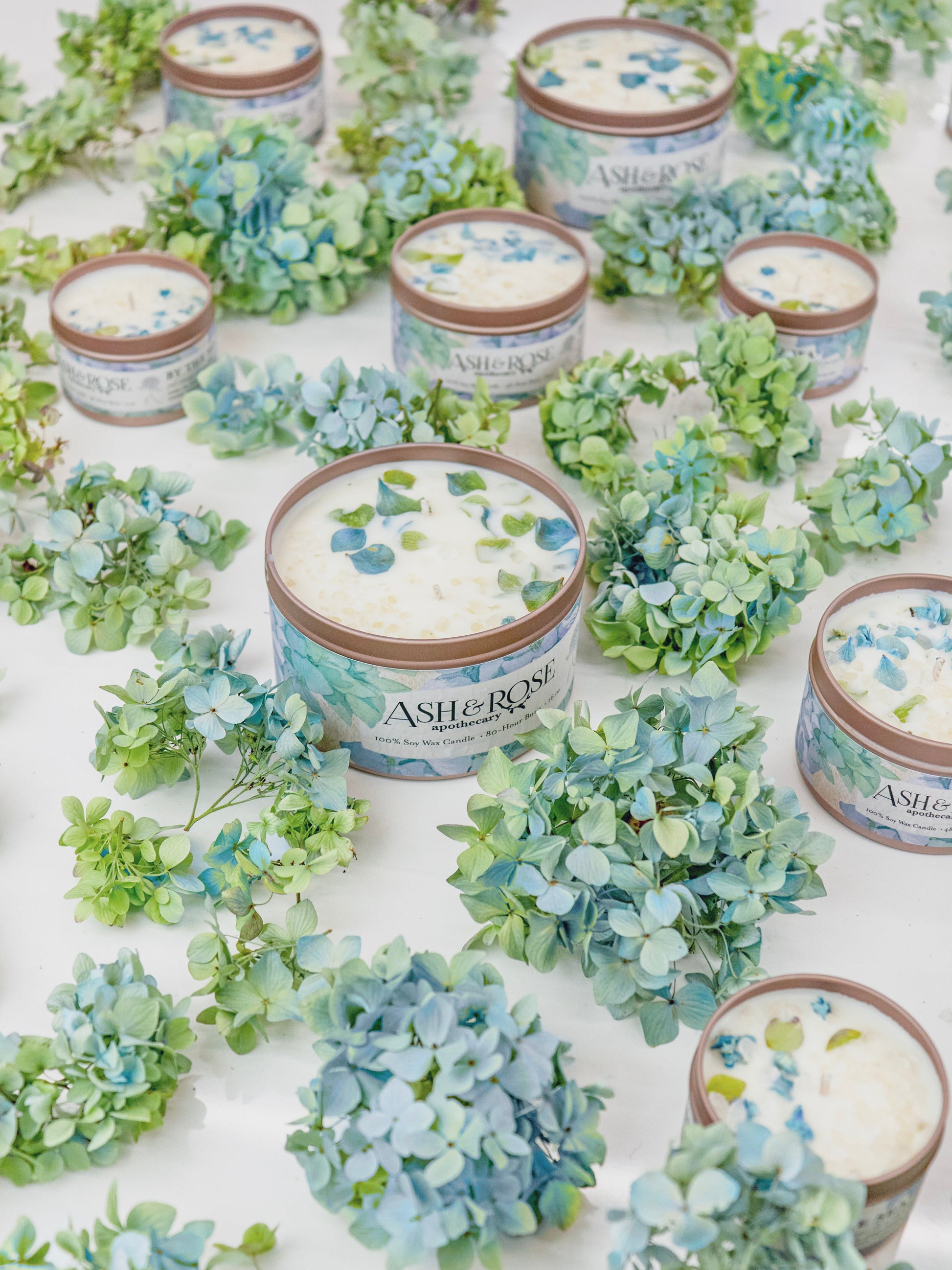 Ash & Rose BY THE SEA Hydrangea Sea Salt candle in a 4 oz jar with hydrangea flower design and sea salt accents.