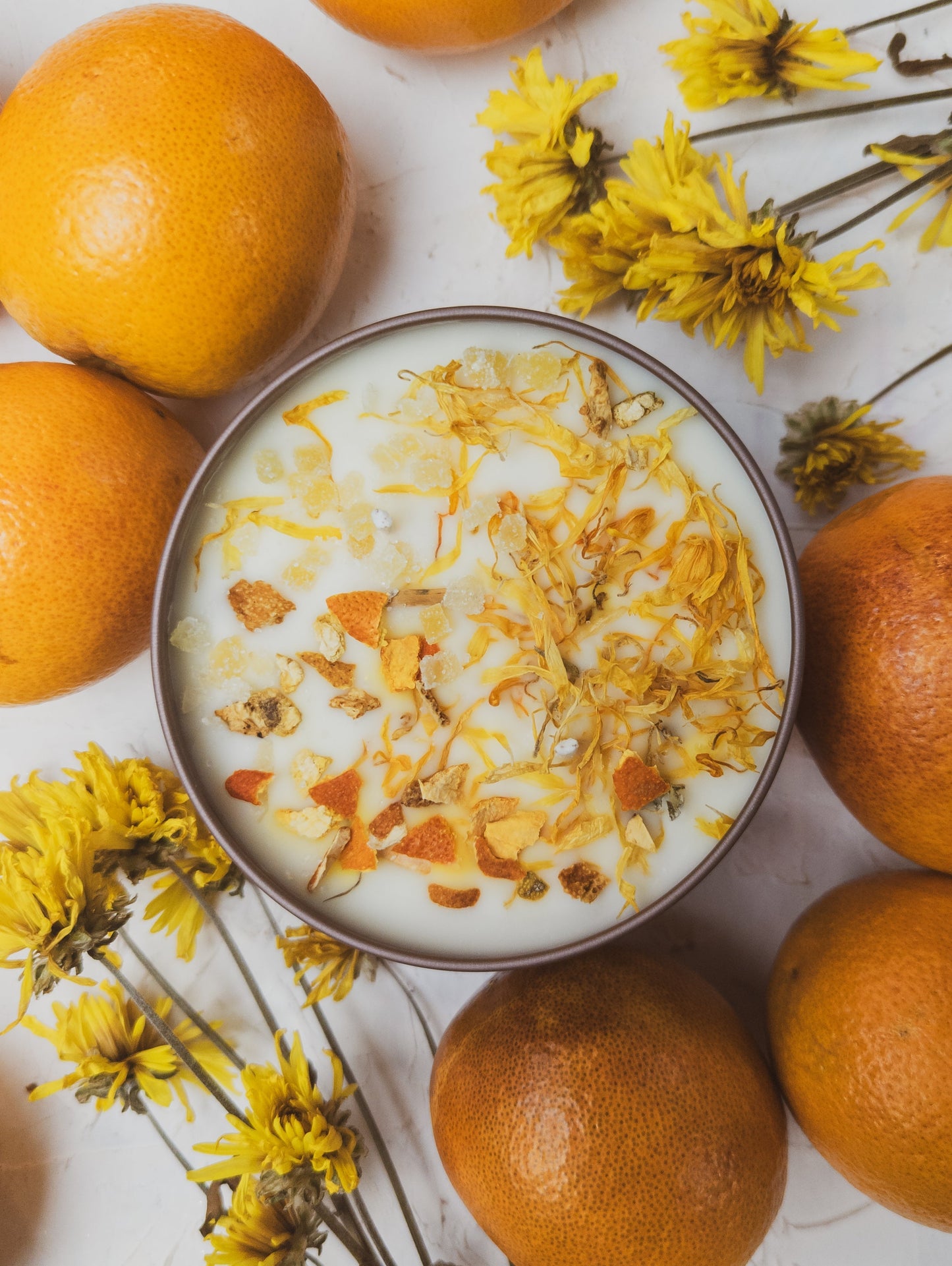 Ash & Rose ZESTY! Orange Ginger candle in a 4 oz jar, featuring bright orange and ginger scent with a textured label.