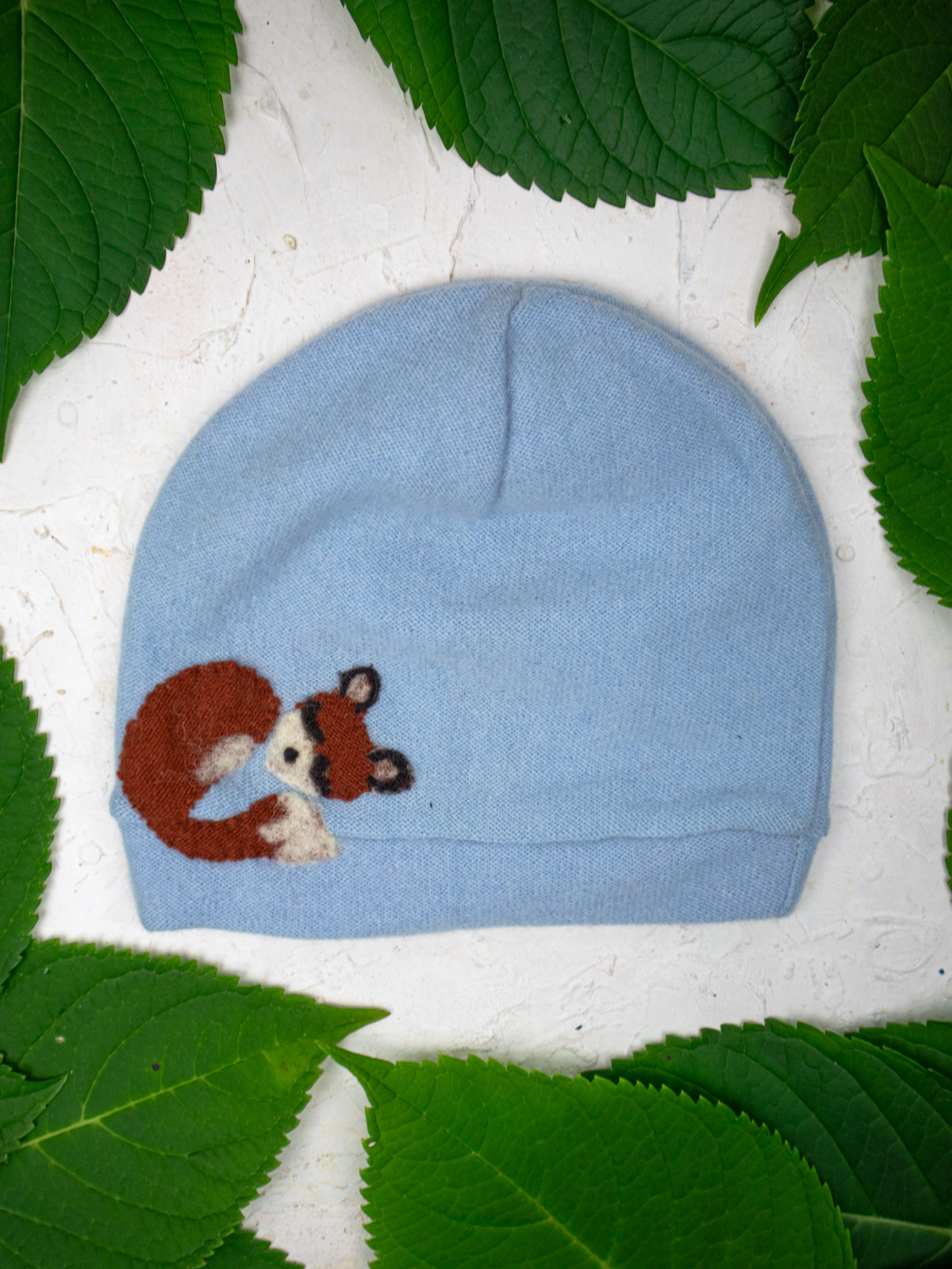Toddler lavender sleeping fox cashmere hat by Ash & Rose featuring soft, cozy knit fabric and a cute fox design.