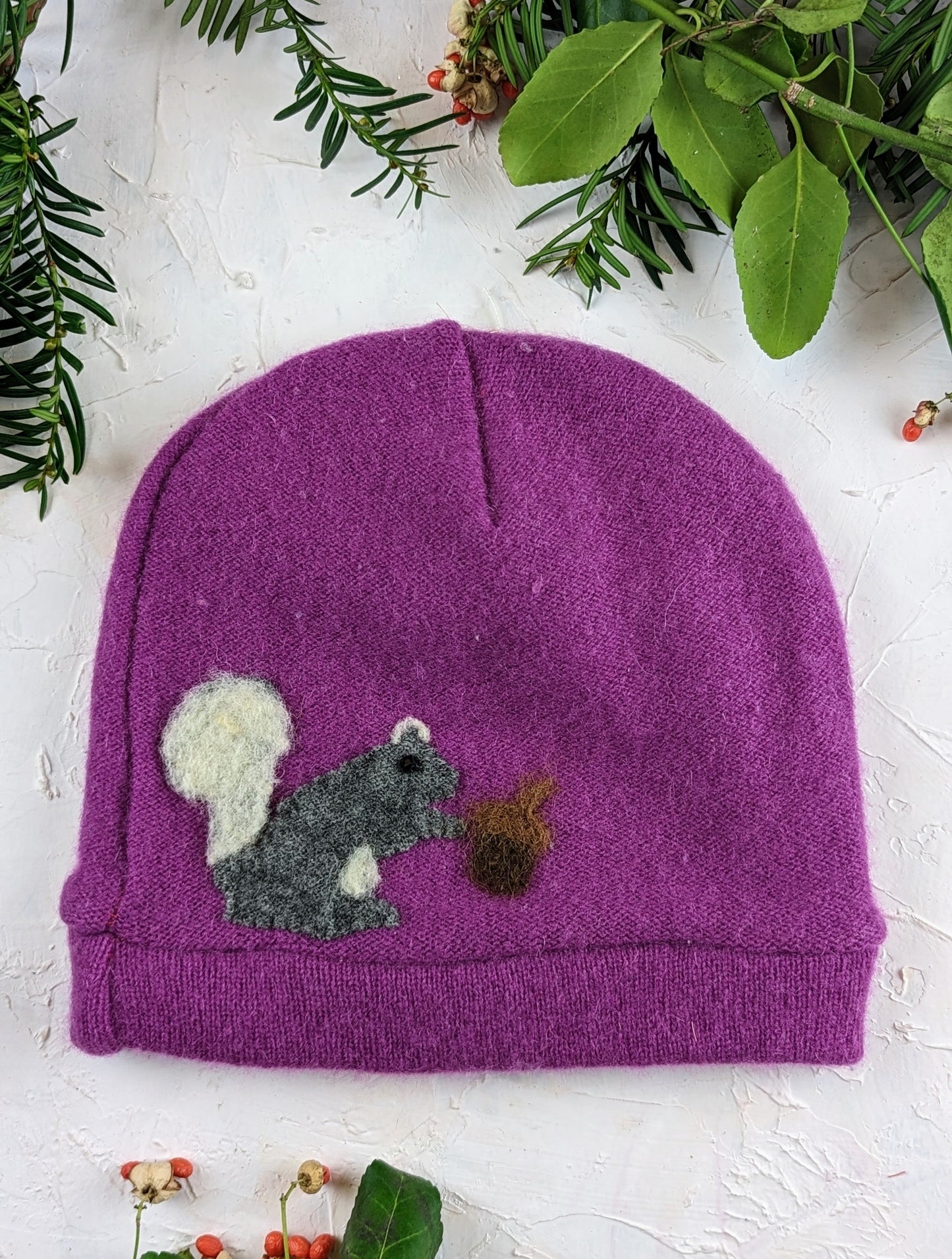 Child's Ash & Rose Squirrel Cashmere Hat in orange, soft knitted hat with squirrel design for warmth and style.