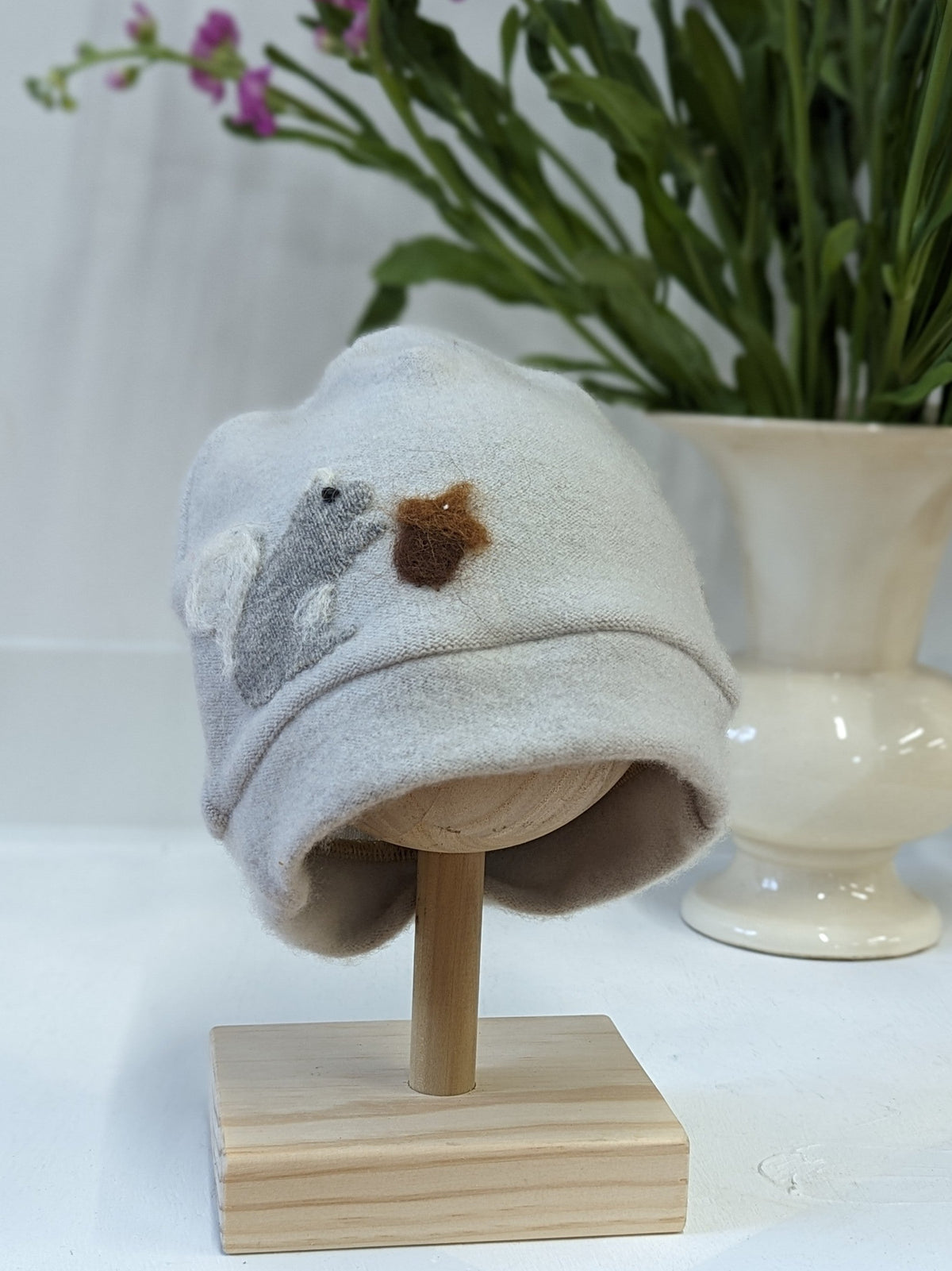 Child's orange squirrel cashmere hat by Ash & Rose featuring a cozy, soft knit design with adorable squirrel details.