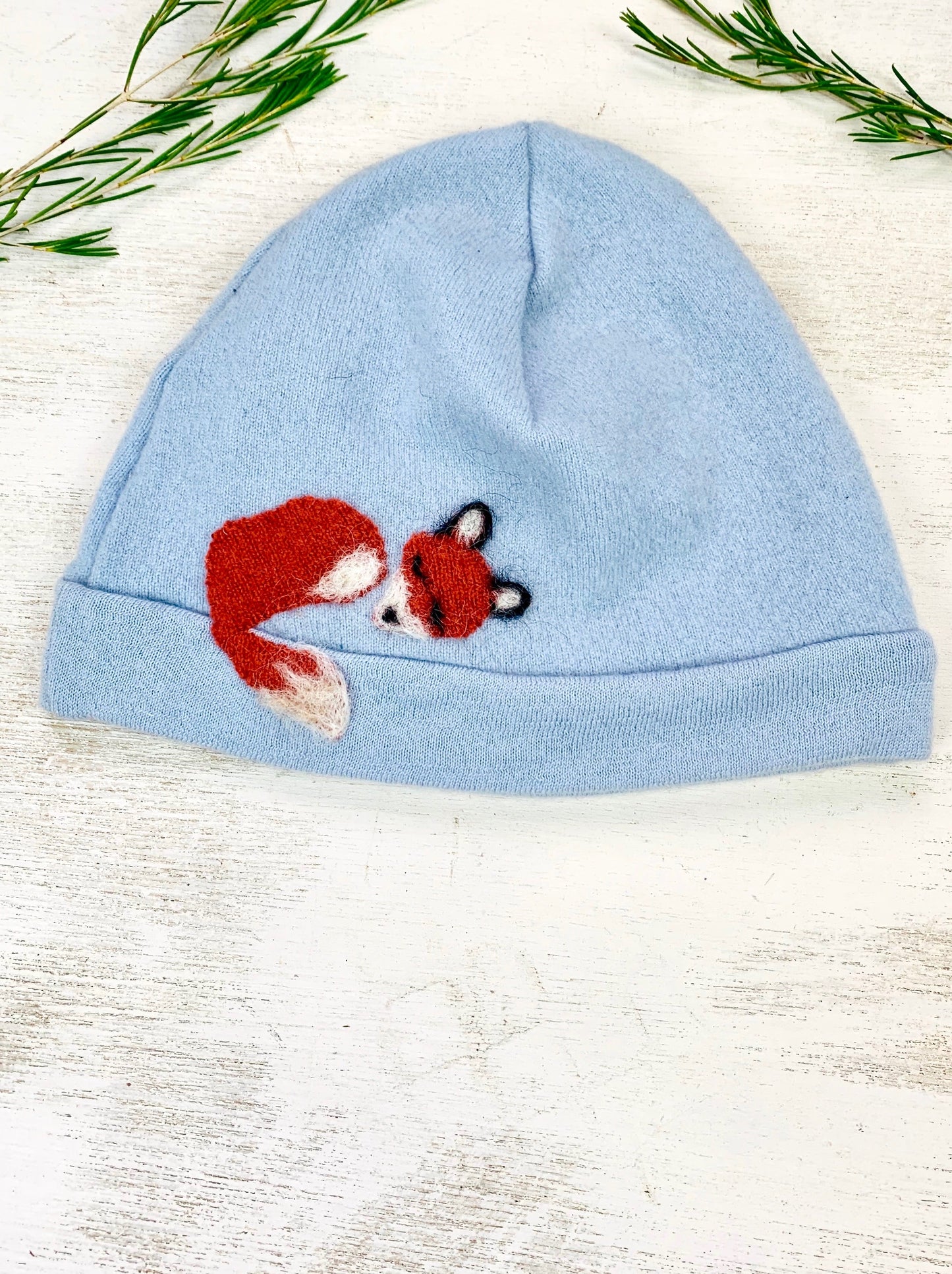 Child's Ash & Rose Sleeping Fox Cashmere Hat in sky blue, soft and cozy, perfect for warmth and comfort.