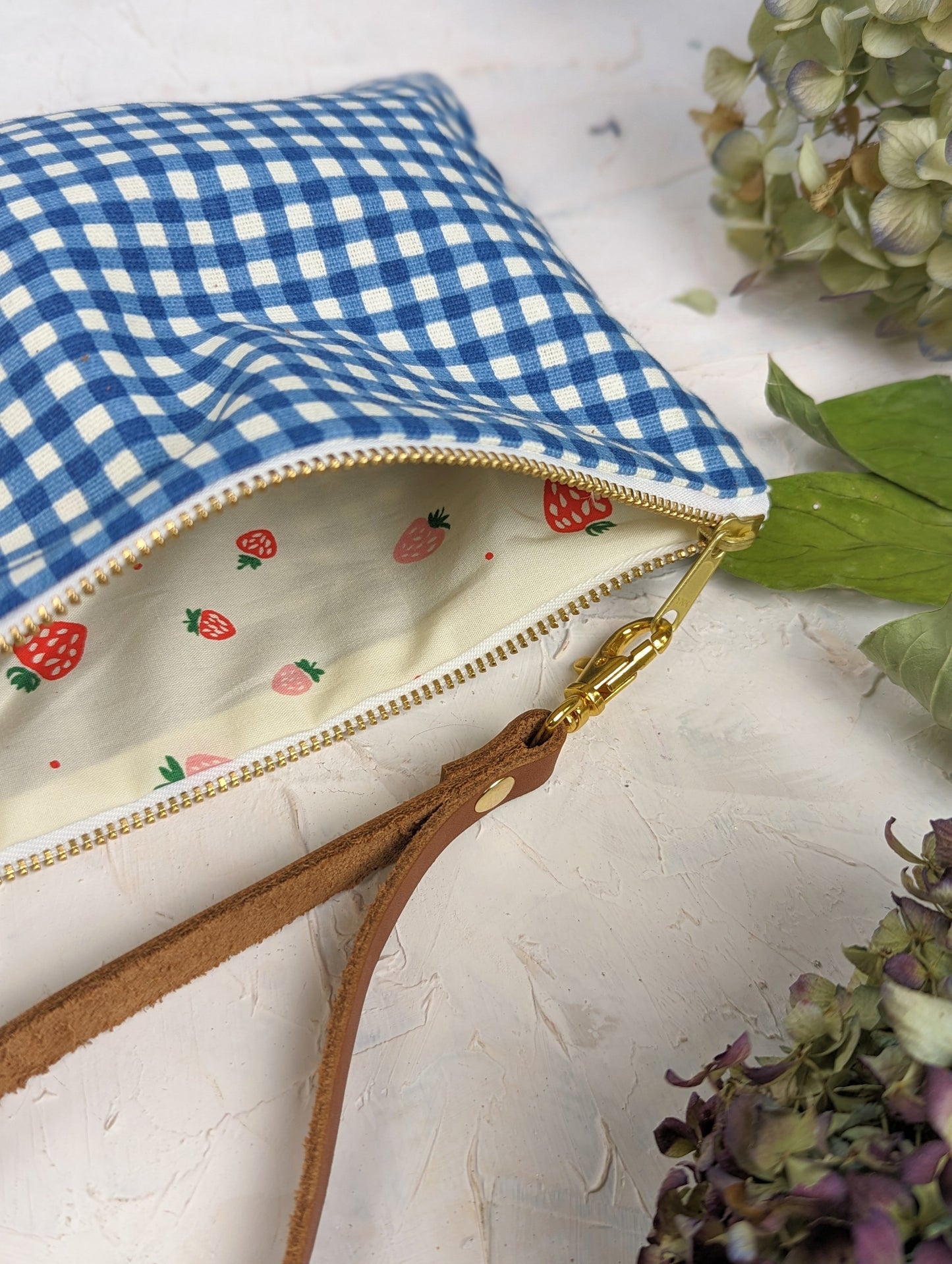 Magenta summer picnic wristlet purse by Ash & Rose with a compact design and wrist strap, perfect for casual outings.