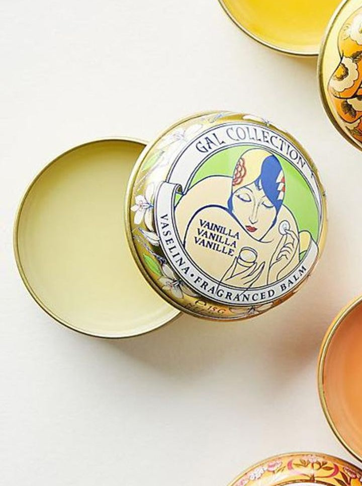 Ash & Rose Perfumeria Gal scented lip balm with orange flavor in a sleek tube, designed for moisturizing and refreshing lips.