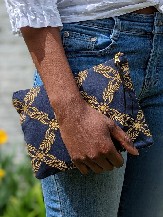 Royal blue Ash & Rose clutch purse with a sleek design and elegant fold-over flap.