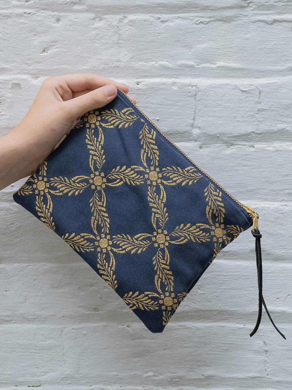 Royal blue Ash & Rose clutch purse with sleek design and zip closure, perfect for evening occasions.