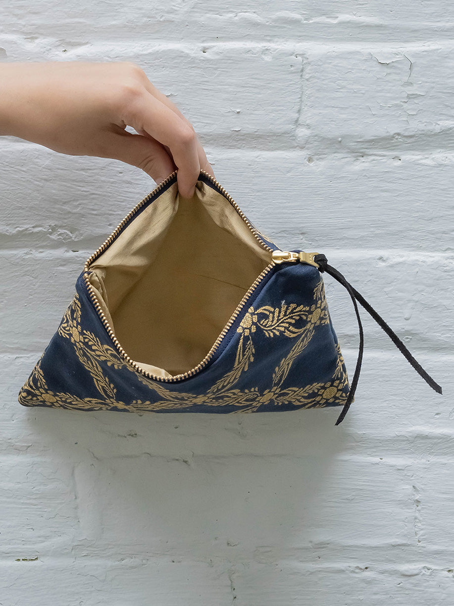 Royal blue Ash & Rose clutch purse with sleek design, featuring a stylish fold-over flap and elegant gold-tone clasp.