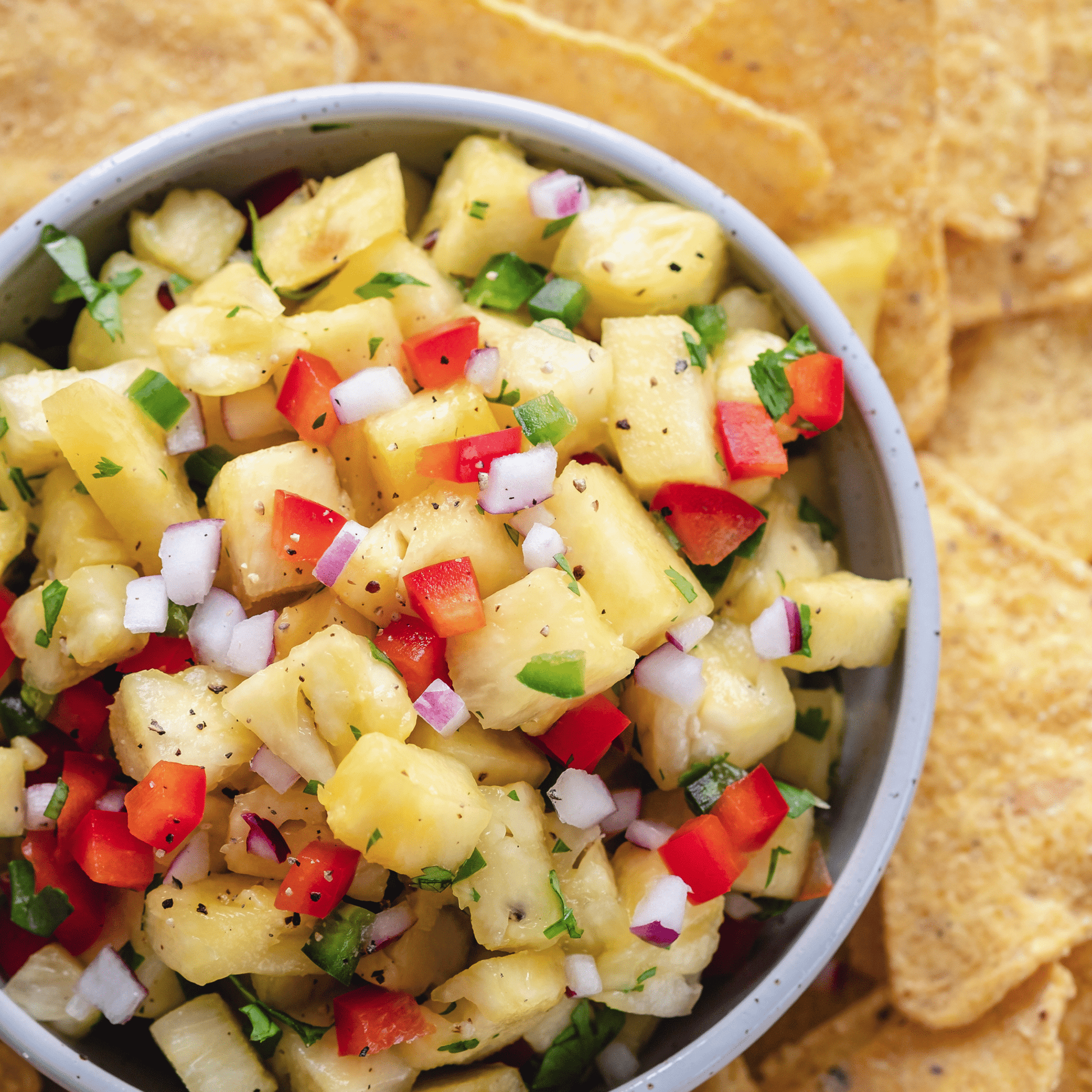 Freeze-dried pineapple pieces in a family size pouch by Augason Farms, showing vibrant dried pineapple slices in the can.