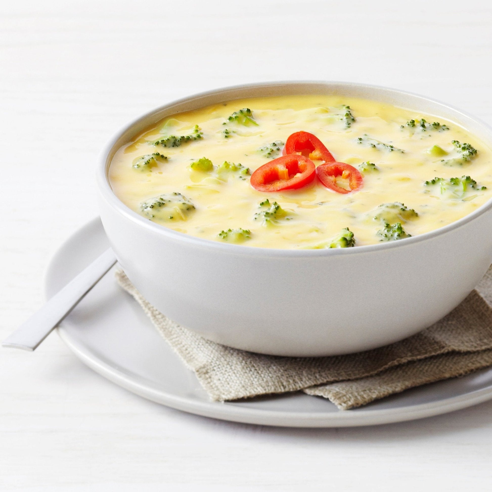 Can of Augason Farms Cheesy Broccoli Soup Mix with 38 servings, showing the product label and can packaging.