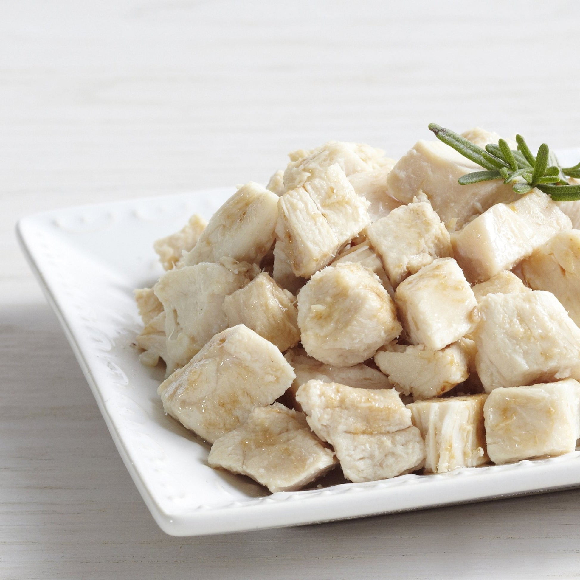 Can of Augason Farms cooked freeze-dried white meat chicken dices for 15 servings, ready to use in meals or camping recipes.