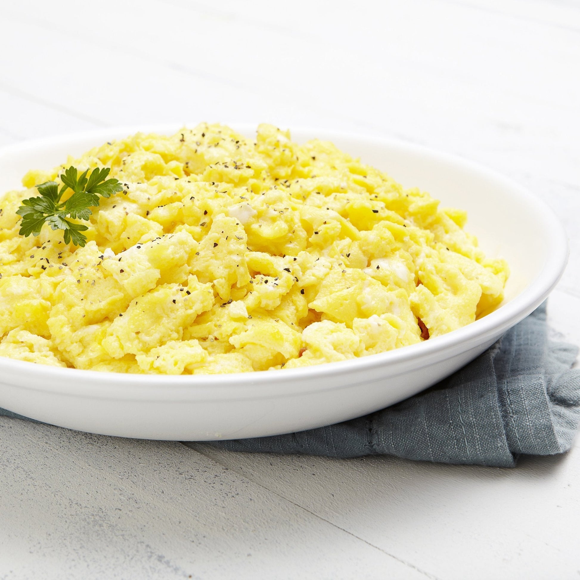 Augason Farms pasteurized dried whole egg powder can for storm prep, containing 85 servings of powdered eggs in a can.