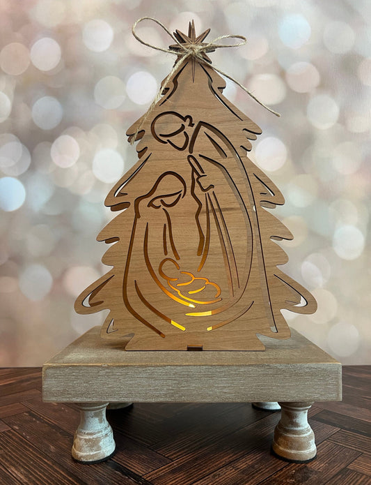Laser-engraved Nativity Scene with Votive Candle by AVEL Woodworking, detailed wood depiction with lit candle centerpiece.