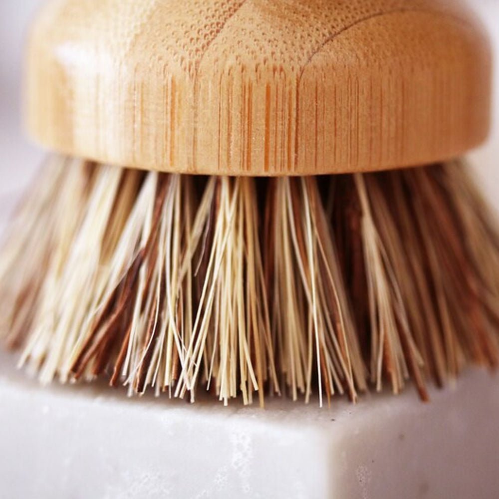 Tilley + Me sustainable bamboo pot scrubber with palm fiber bristles for effective dishwashing, eco-friendly utensil cleaning.