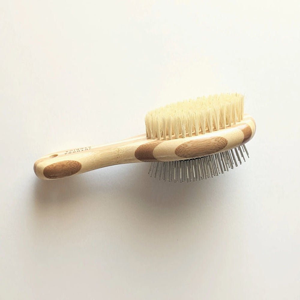 Double-sided dog grooming brush by Tilley + Me with bamboo handle, featuring bristle and wire for shedding and detangling.