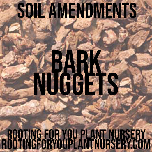 Bark Nuggets soil amendment from Rooting For You Plant Nursery, showing close-up of dark, textured bark pieces for garden soil enhancement.