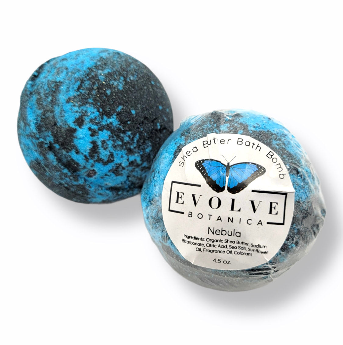 Colorful Evolve Botanica Nebula bath bomb dissolving in water, creating vibrant bubbles and swirling colors in a relaxing bath setting.