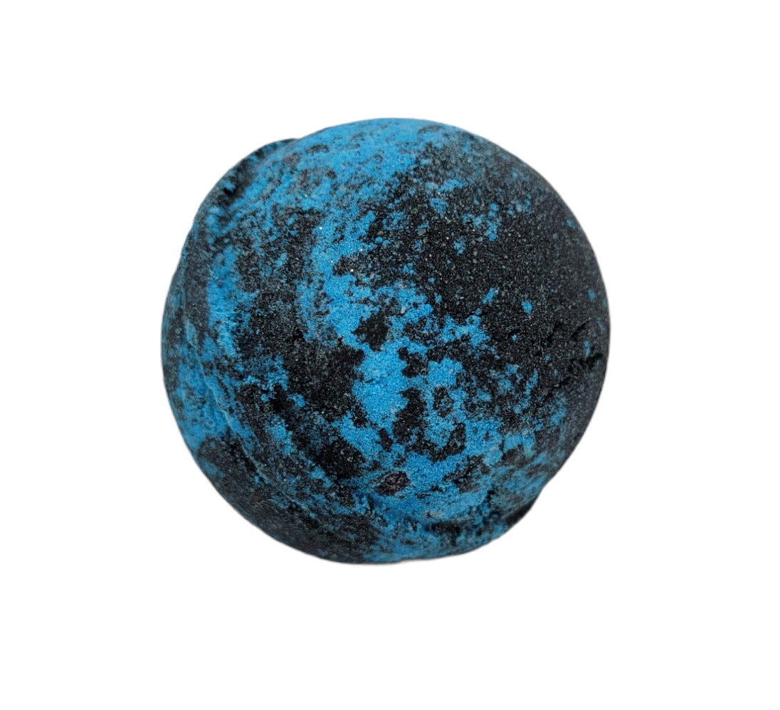 Evolve Botanica Nebula bath bomb floating in water with vibrant colors and swirling patterns, ready to relax in a luxurious bath.