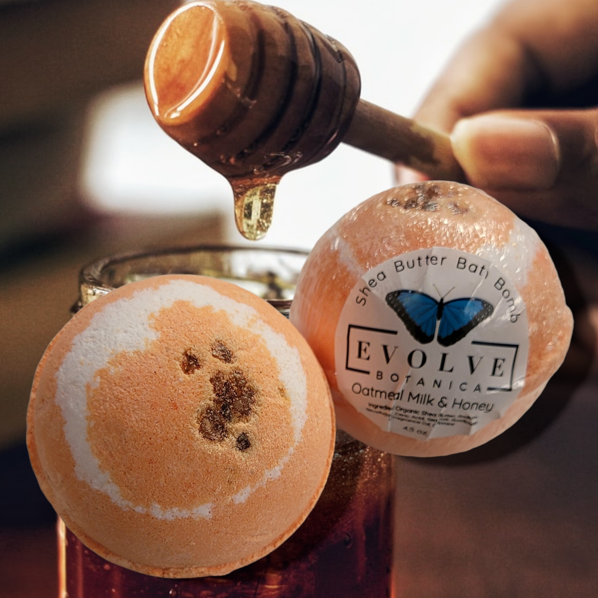 Evolve Botanica oatmeal milk honey bath bomb with a white and beige sphere, ready for a relaxing bath.