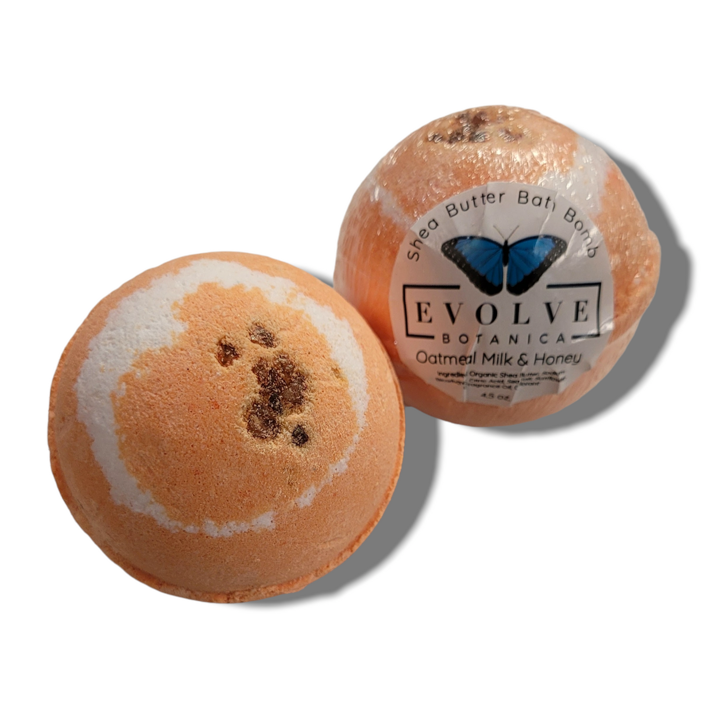 Evolve Botanica oatmeal milk honey bath bomb with floral and creamy tones, spherical shape, and textured surface.