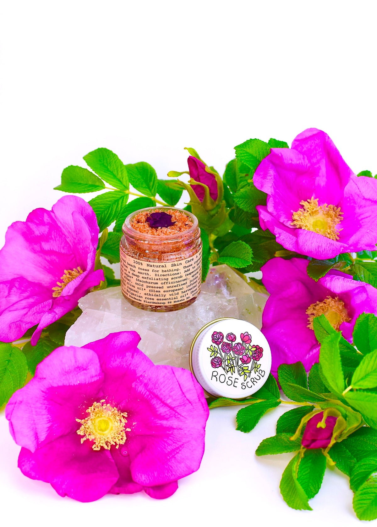 Plant Makeup Beach Rose Scrub in a jar with textured rose-scented exfoliating scrub visible, perfect for skincare.
